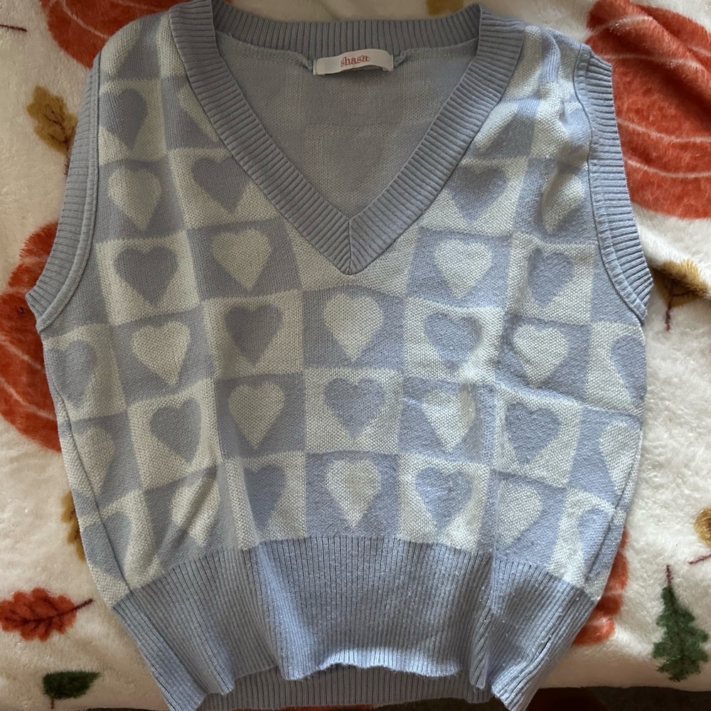 Blue and white vest with hearts